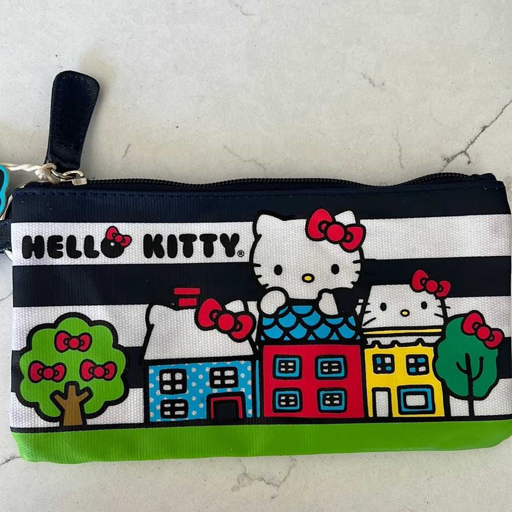 Brand new with tags. Hello Kitty lounge fly, mini purse type bag